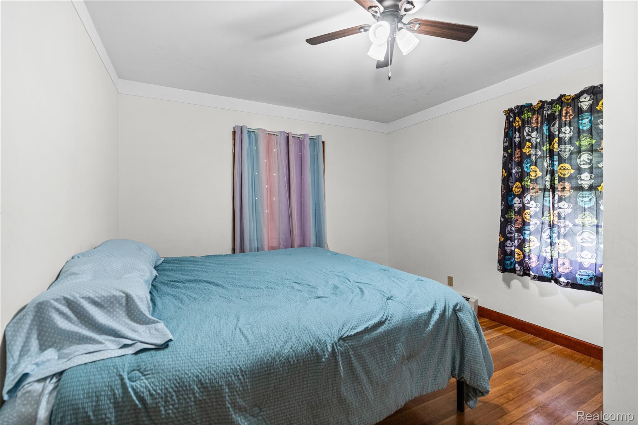 6383 Lapeer Road Burton, MI 48509 - Photo 14 of 44 Bedroom with crown molding, wood-type flooring, and ceiling fan