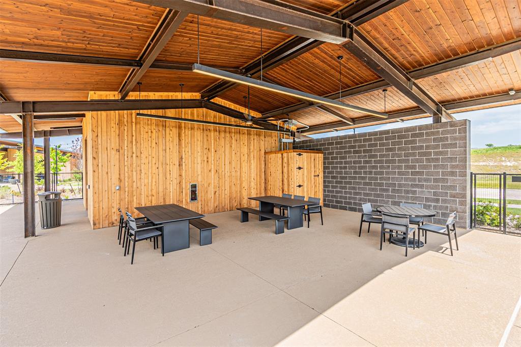 116 Derrett Lane Rhome, TX 76078 - Photo 27 of 30 a building outdoor space with patio furniture and couches
