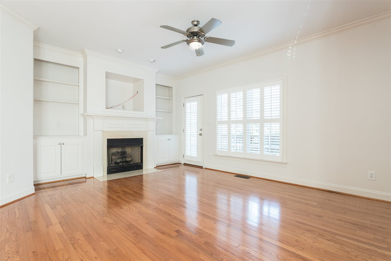 1320 Cameron View Court Raleigh, NC 27607 - Photo 5 of 30 Gas Logs Fireplace and Access to Main Level Deck and Storage Room