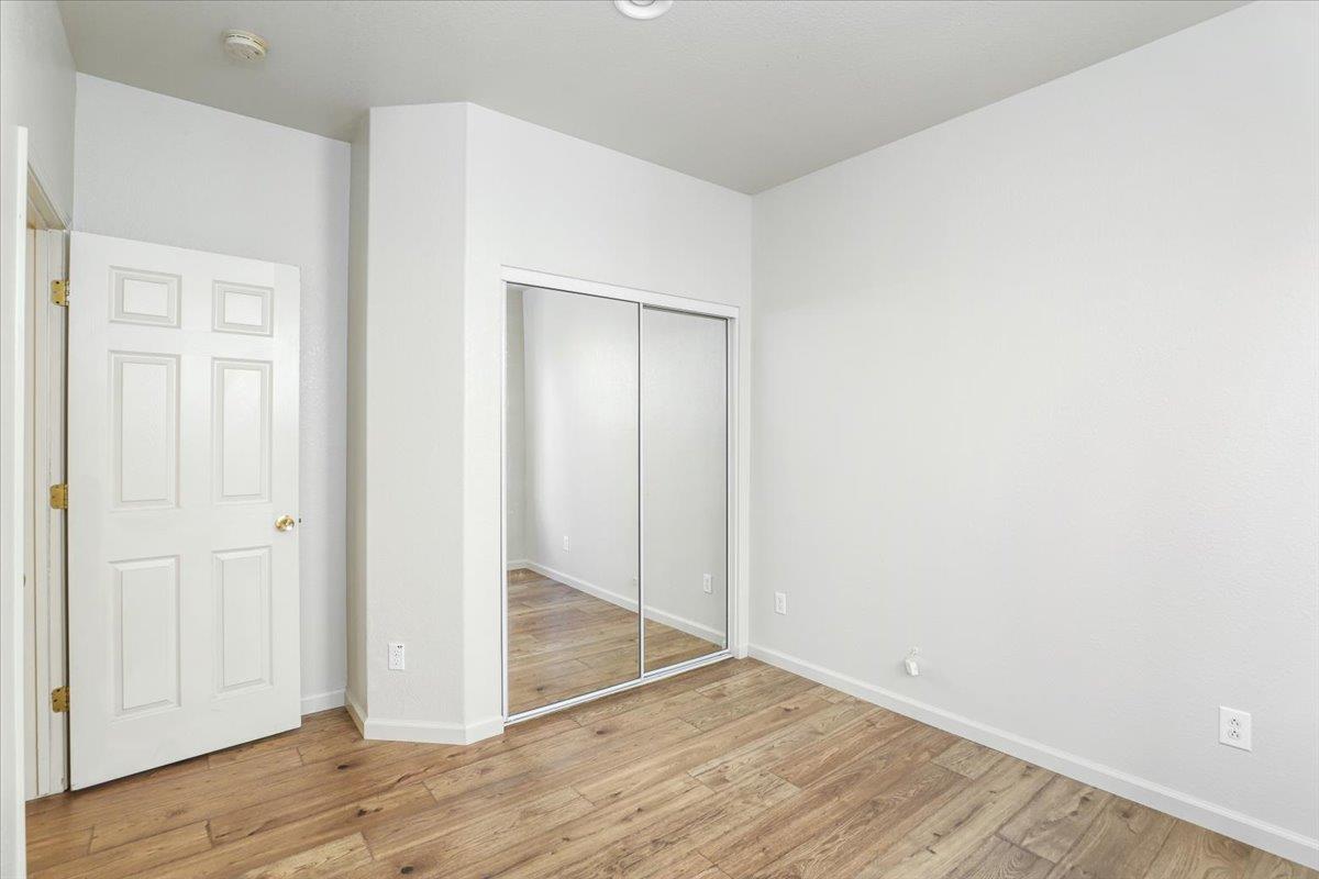 4467 Glenbrook Drive Tracy, CA 95377 - Photo 12 of 26 an empty room with wooden floor