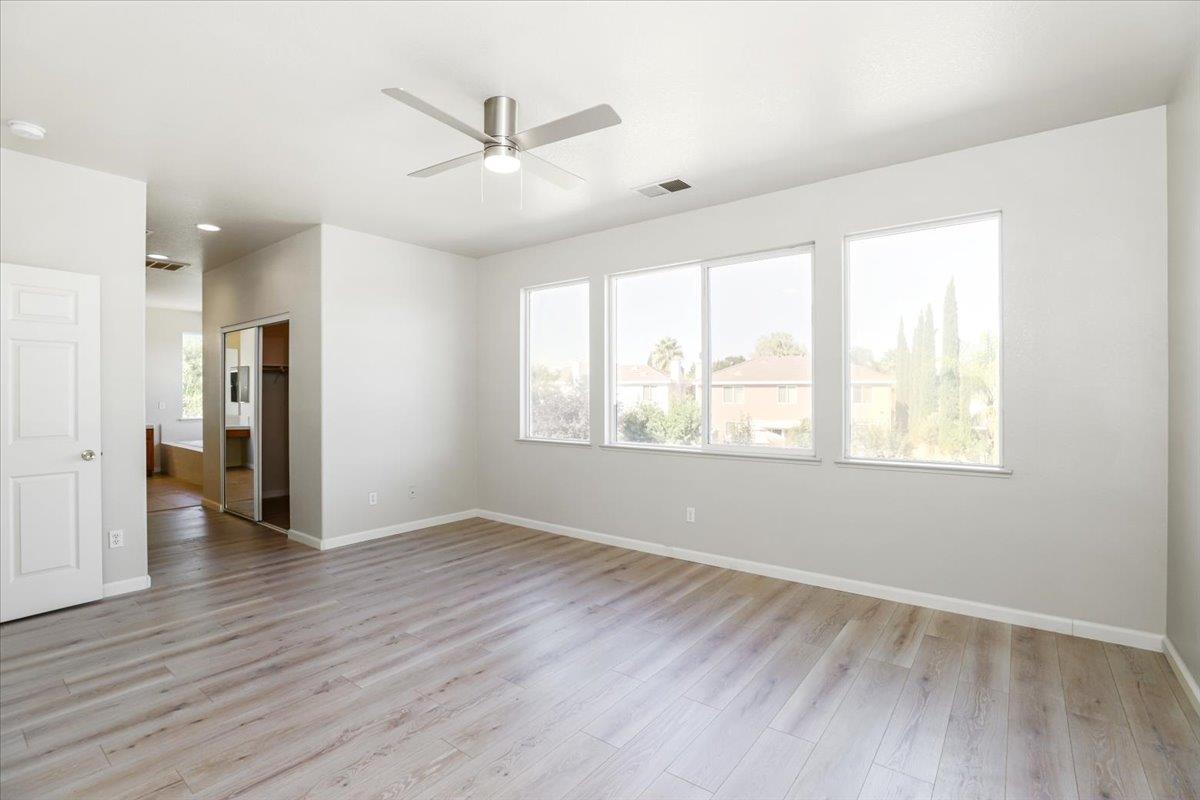 4467 Glenbrook Drive Tracy, CA 95377 - Photo 21 of 26 wooden floor in an empty room with a window