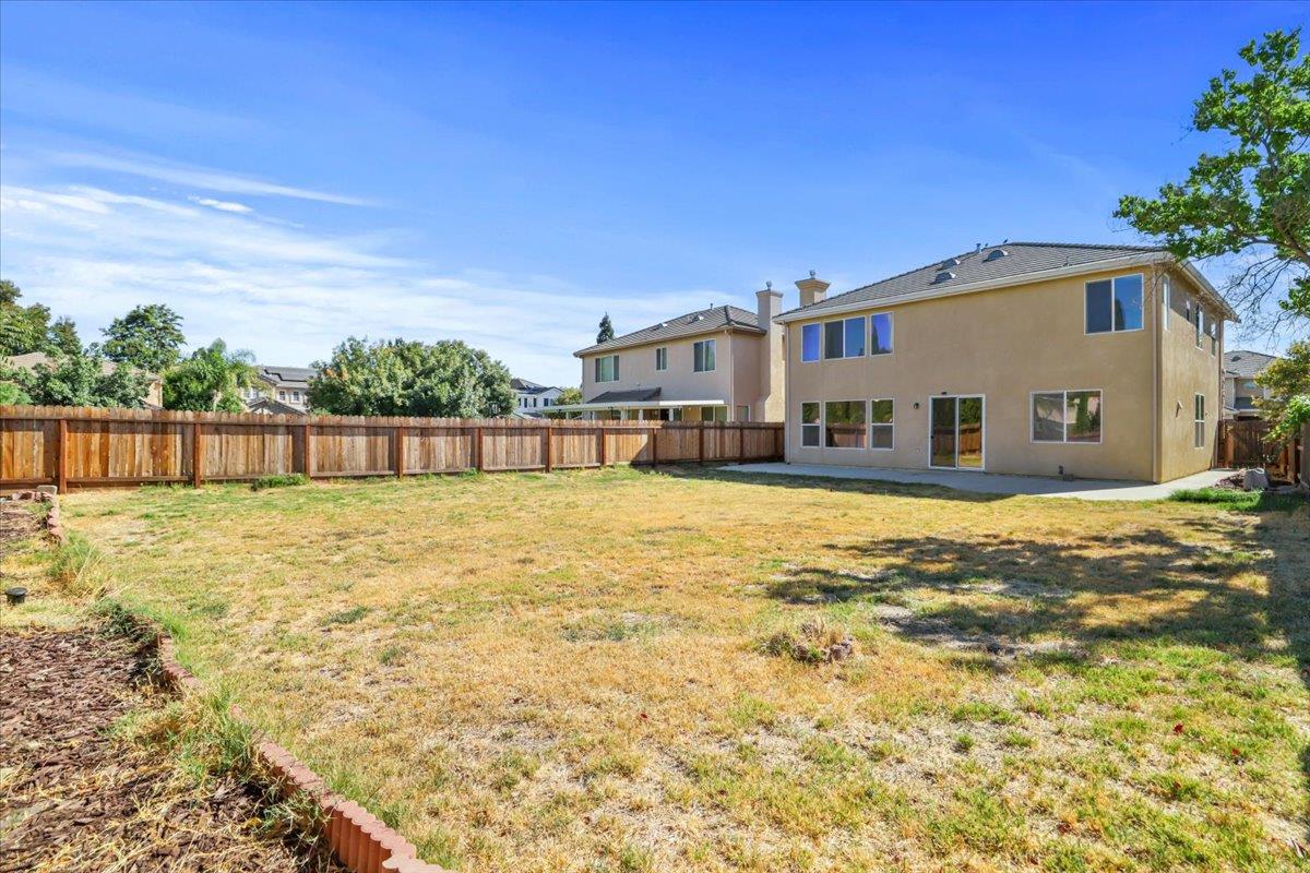 4467 Glenbrook Drive Tracy, CA 95377 - Photo 24 of 26 a front view of a house with a yard