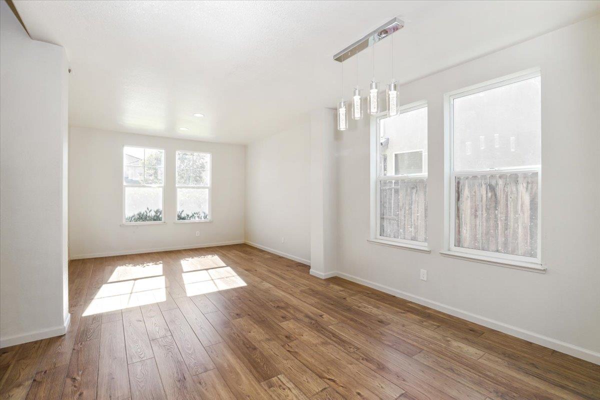 4467 Glenbrook Drive Tracy, CA 95377 - Photo 6 of 26 wooden floor in an empty room with a window