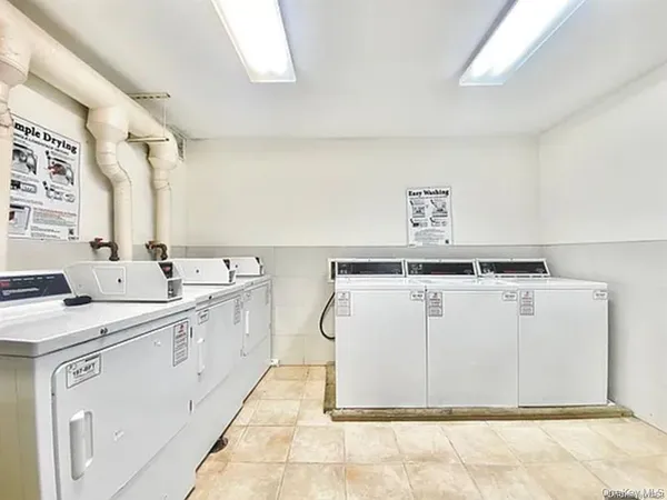 a utility room with a sink a washer and dryer