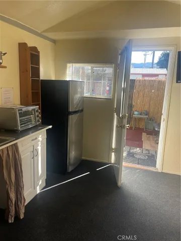 a kitchen with stainless steel appliances wooden cabinets and a counter top space