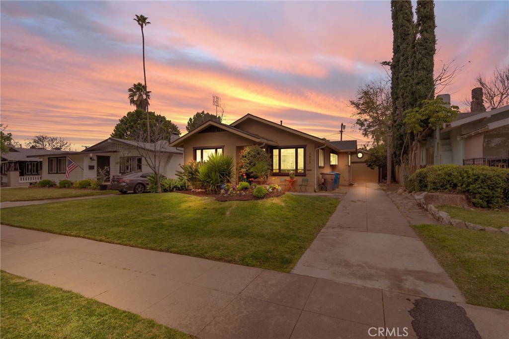 3673 Linwood Place Riverside, CA 92506 - Photo 1 of 1 a front view of a house with a yard