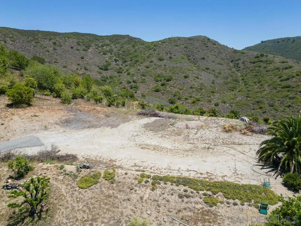 0 El Coyote Run, Unit PM02721 Fallbrook, CA 92028 - Photo 11 of 19 a view of a dry field with mountains in the background