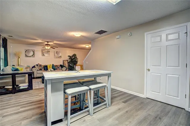 a view of kitchen with cabinets and wooden floor