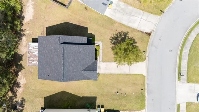 an aerial view of a house with swimming pool