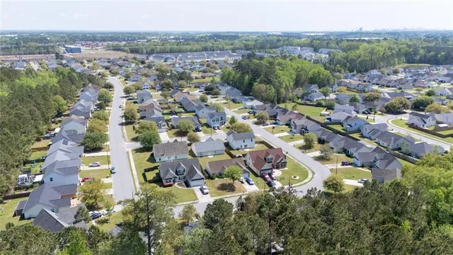 an aerial view of residential building and trees
