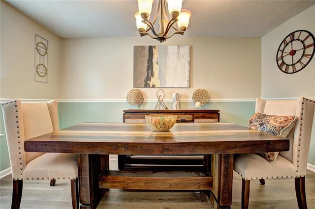 a view of a kitchen with a table and chairs