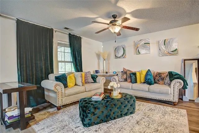 a living room with furniture and a large window