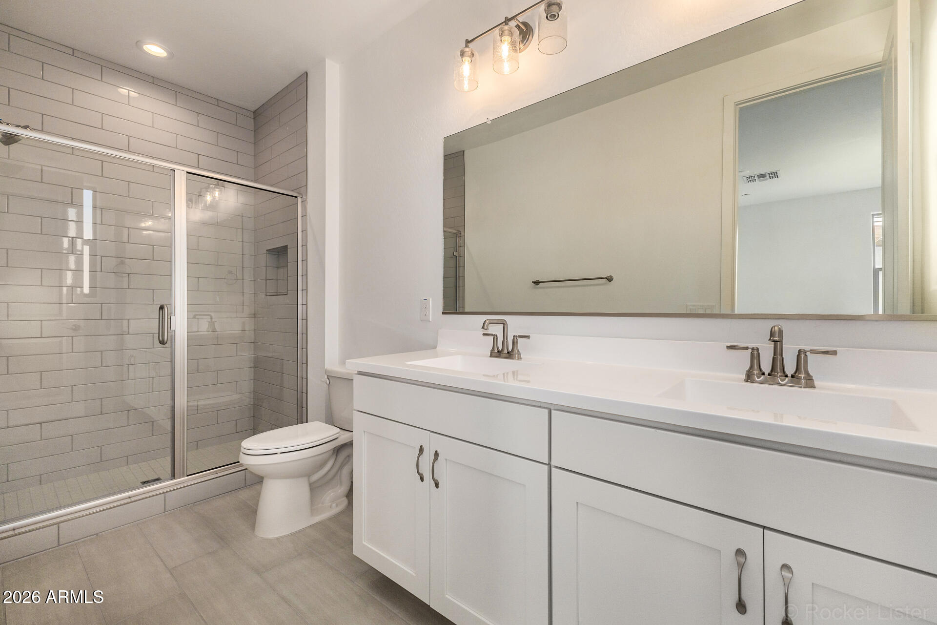 20618 West Thomas Road Buckeye, AZ 85396 - Photo 18 of 38 a bathroom with a sink a toilet and shower
