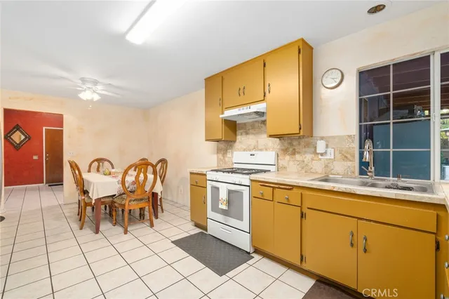 a view of a dining table chairs and chandelier