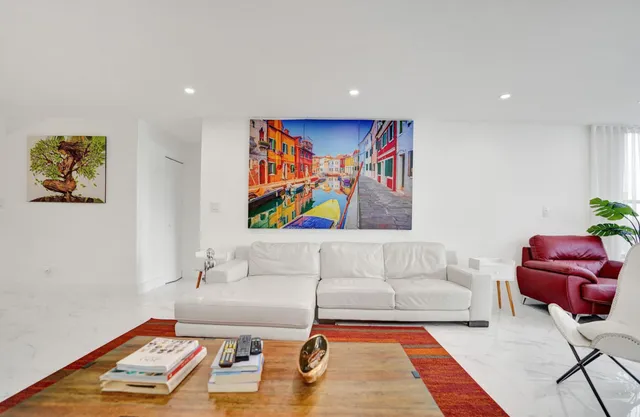 a view of a dining room with furniture and window