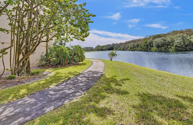 a kitchen with stainless steel appliances a sink a stove and a refrigerator