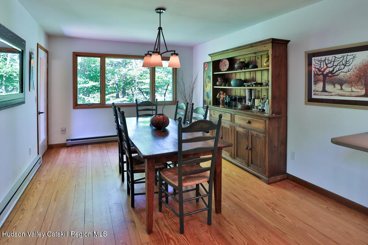 3 Quarry Road Shandaken, NY 12480 - Photo 12 of 29 a view of a dining room with furniture window and wooden floor