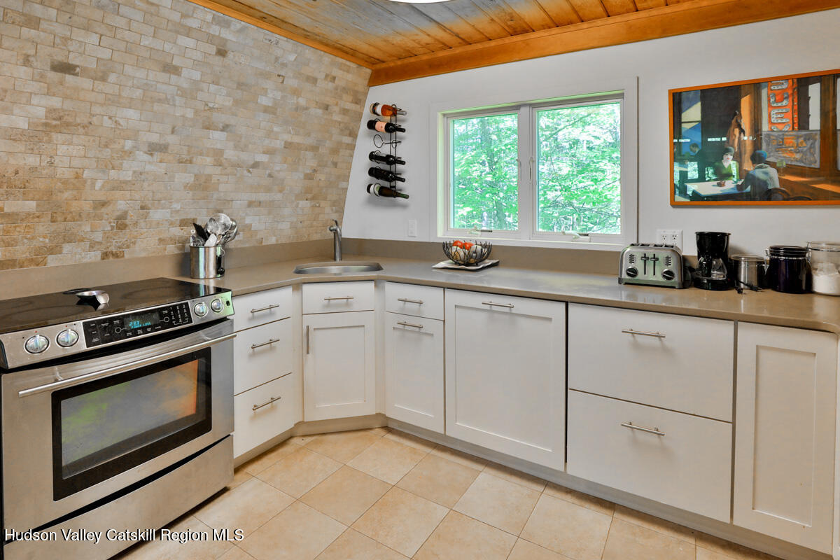 3 Quarry Road Shandaken, NY 12480 - Photo 16 of 29 a kitchen with a stove a sink and a window