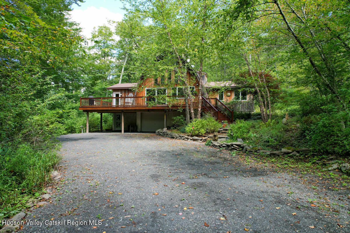3 Quarry Road Shandaken, NY 12480 - Photo 5 of 29 a front view of a house with a yard and garage