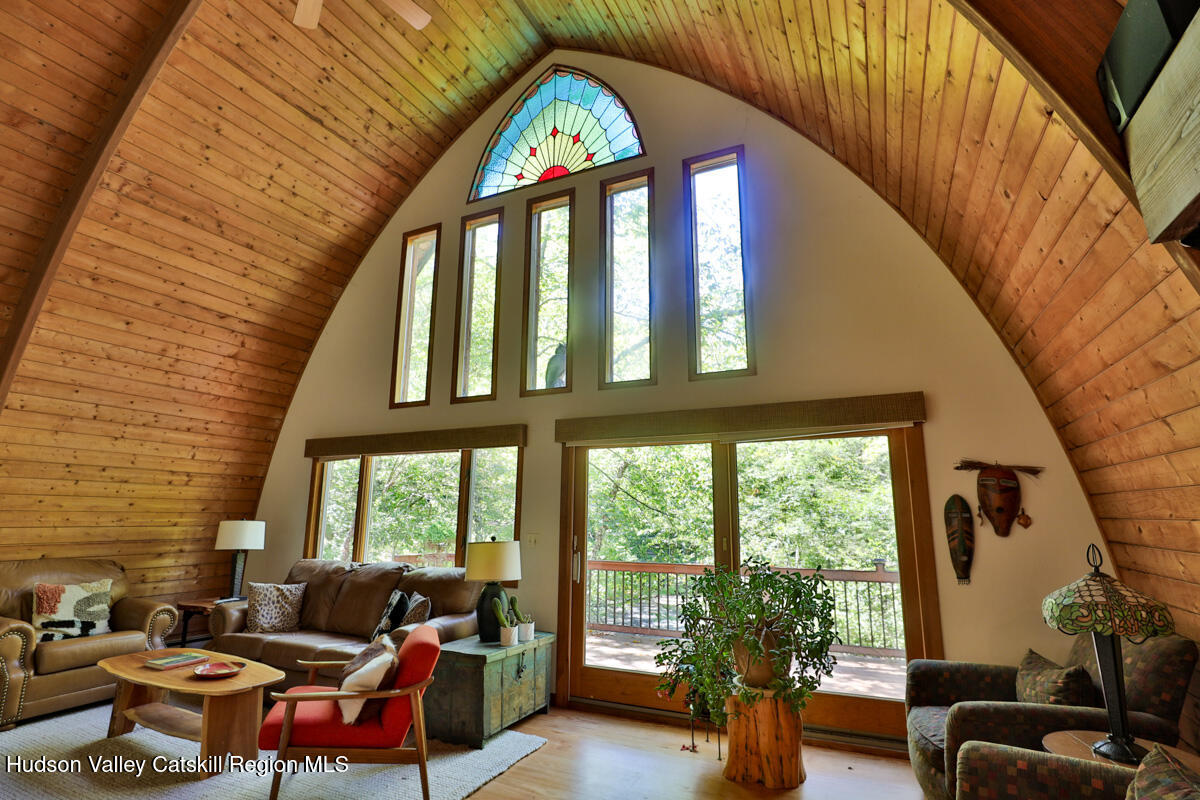 3 Quarry Road Shandaken, NY 12480 - Photo 8 of 29 a living room with furniture and a floor to ceiling window