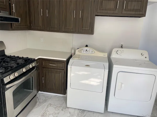 a view of a sink and cabinets