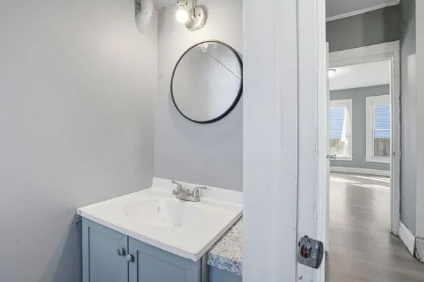 a bathroom with a sink and a mirror