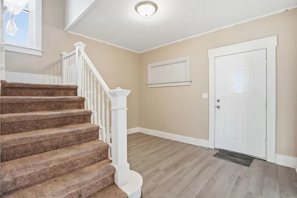 a view of entryway with wooden floor