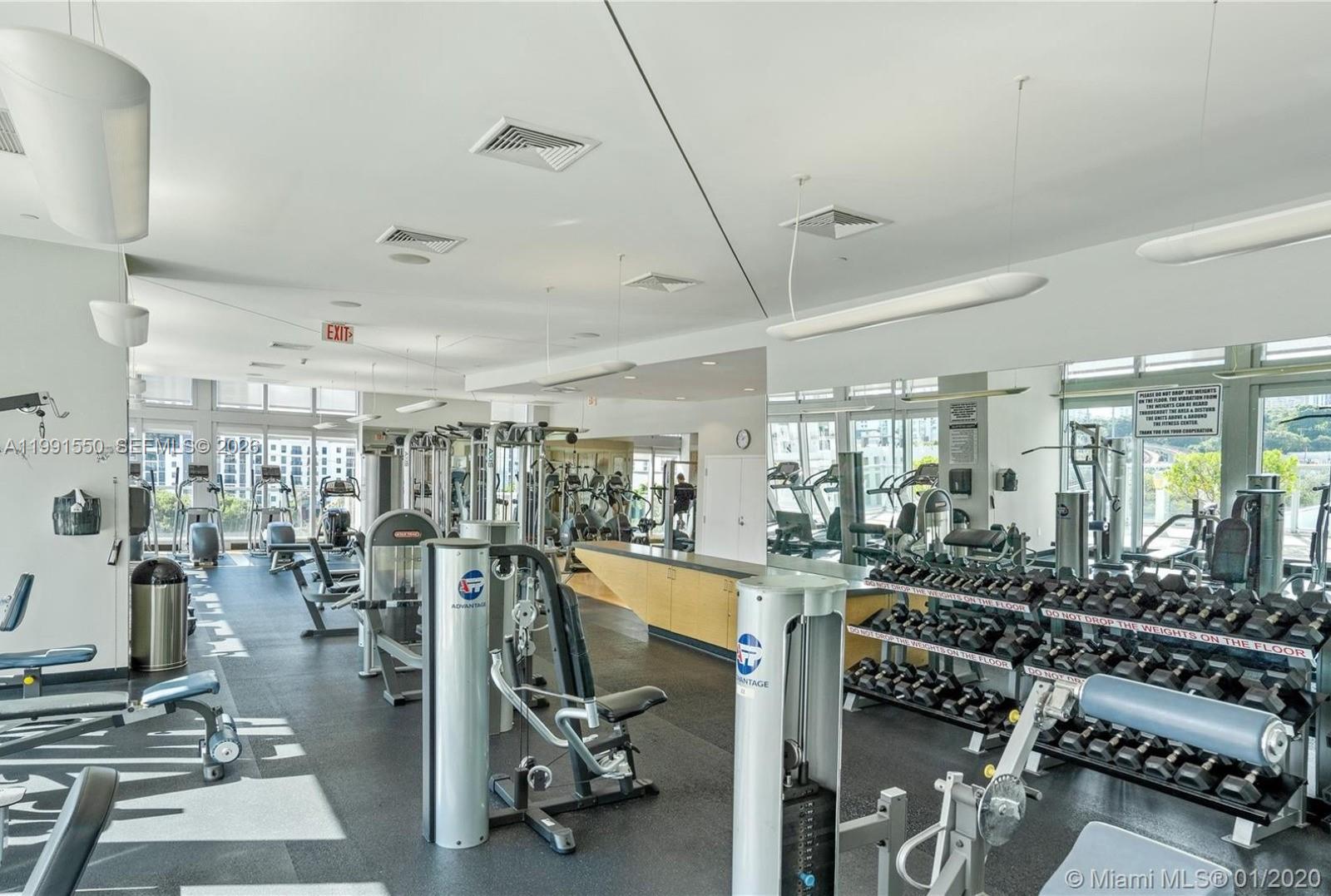 79 Southwest 12th Street, Unit 1102S Miami, FL 33130 - Photo 18 of 24 a view of a room with gym equipment