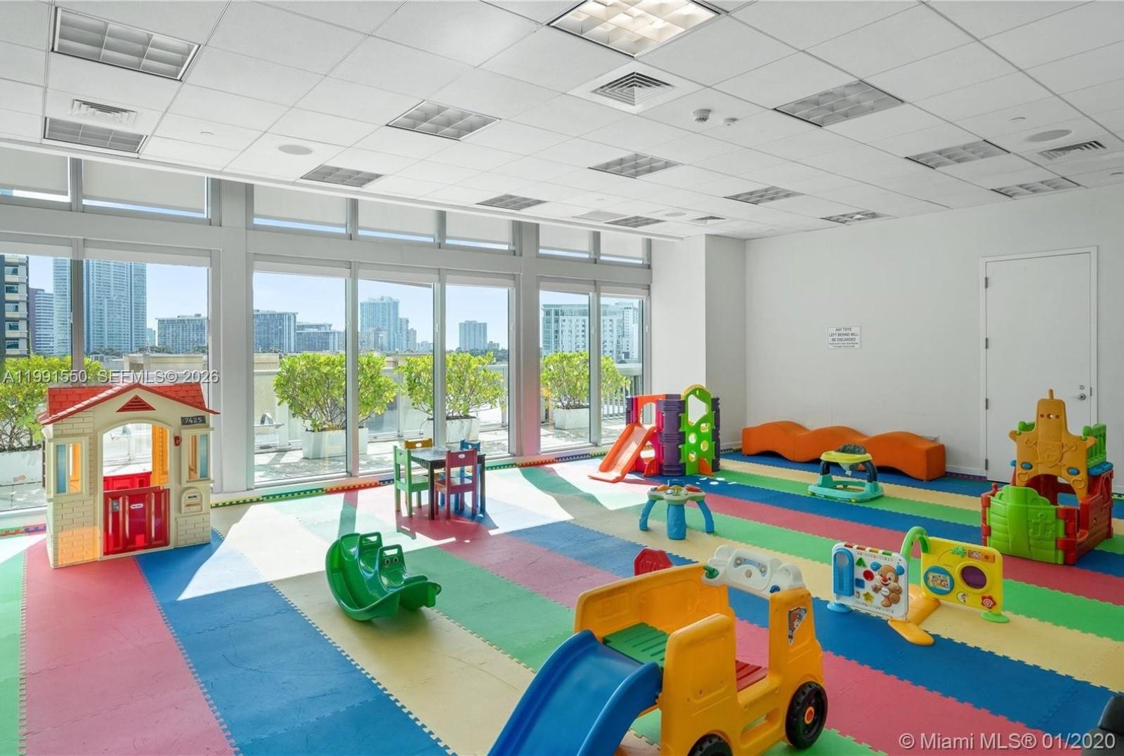 79 Southwest 12th Street, Unit 1102S Miami, FL 33130 - Photo 20 of 24 a room with musical instrument pool table and windows