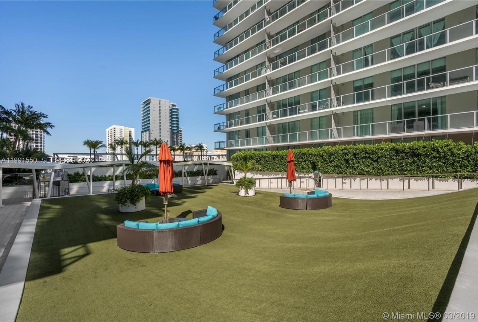79 Southwest 12th Street, Unit 1102S Miami, FL 33130 - Photo 24 of 24 a view of a swimming pool with outdoor seating