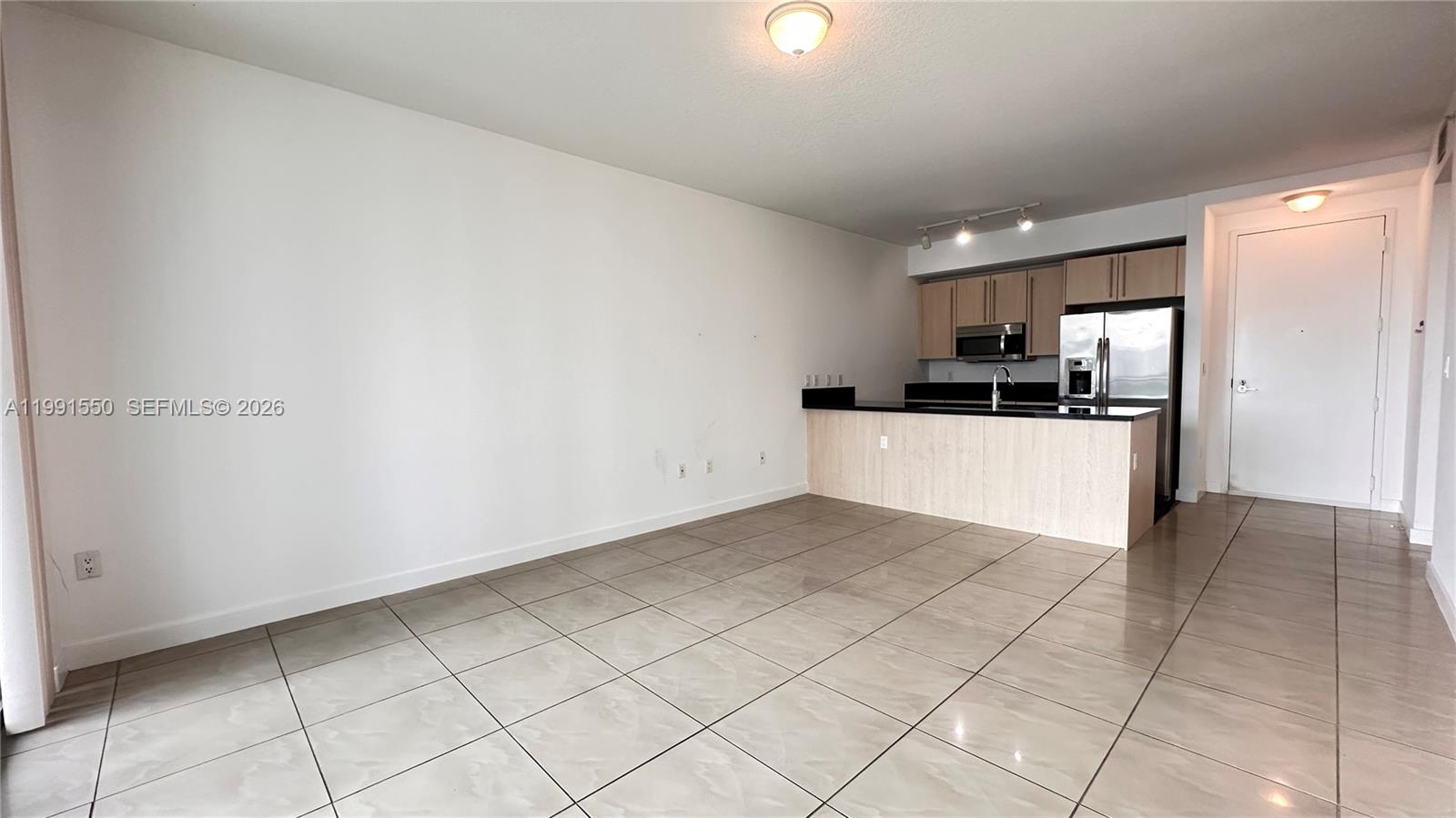 79 Southwest 12th Street, Unit 1102S Miami, FL 33130 - Photo 6 of 24 a view of a kitchen with a sink