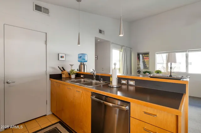 a room with sink cabinets and window