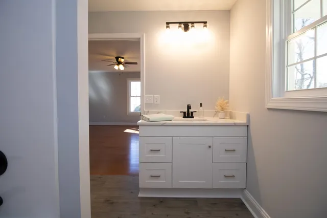 a bathroom with a sink and a mirror