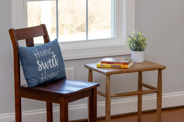 a view of a room that has a table and a chair