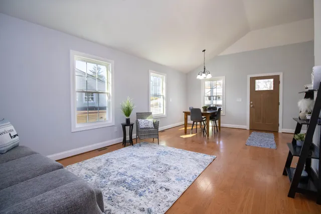 a view of a livingroom with furniture and wooden floor