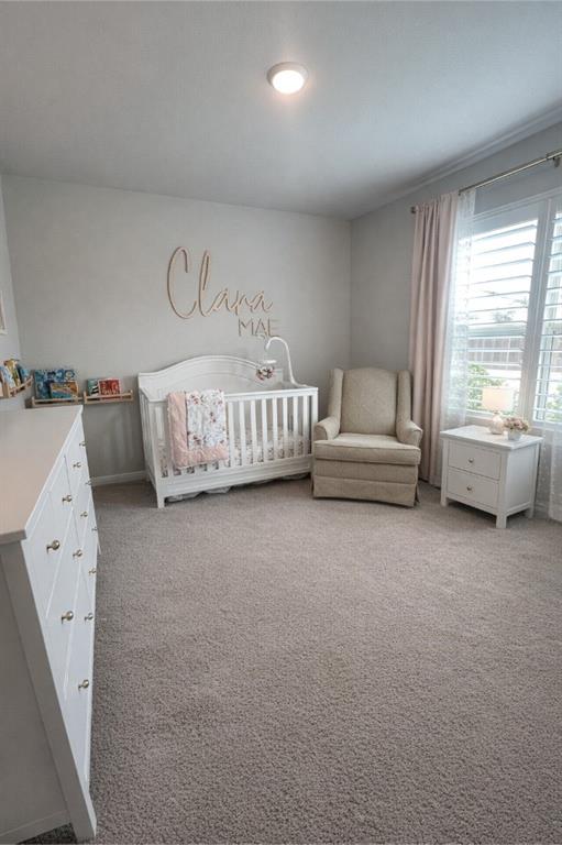 6609 Adderly Road Pilot Point, TX 76258 - Photo 10 of 15 a spacious bedroom with a bed and a couch