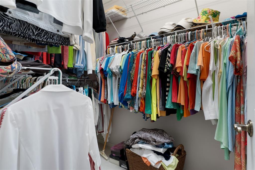 10081 Georgetown Court Weeki Wachee, FL 34613 - Photo 27 of 76 a view of walk in closet with clothes and shoes