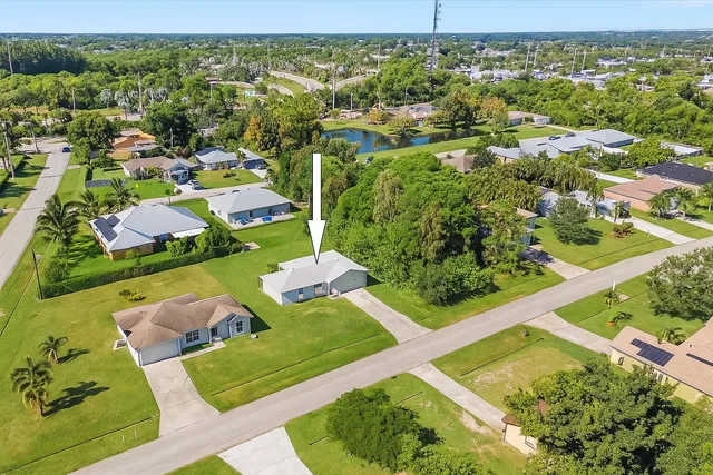 an aerial view of residential houses with outdoor space