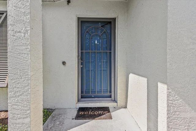 a view of a door and a bathroom