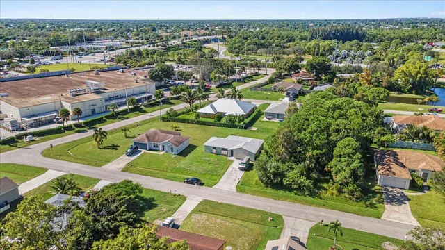 a view of a house with a yard and garage