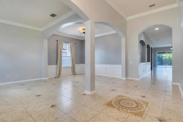 a large kitchen with stainless steel appliances granite countertop a large counter top and a stove top oven