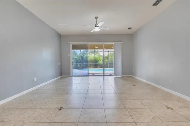 a view of a big room with a kitchen