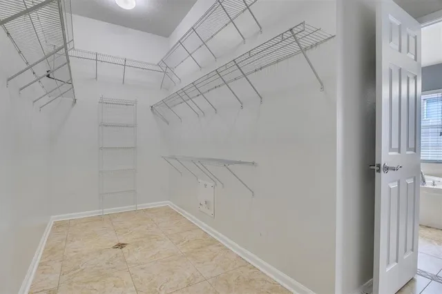 a spacious bathroom with a tub a sink and a shower