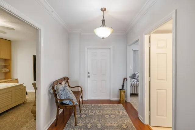a view of a dining room with furniture wooden floor and chandelier