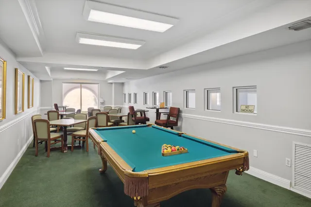 a living room with lots of furniture and wooden floor