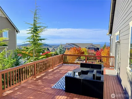 a view of a balcony with wooden floor