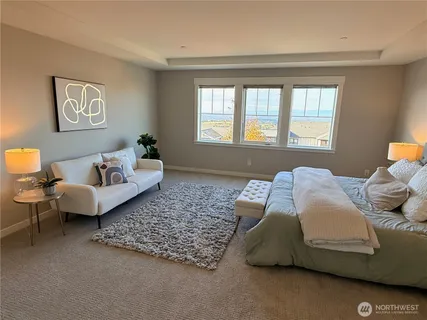 a bedroom with two beds and a couch