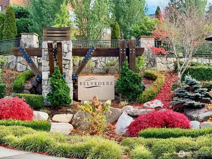 a view of swimming pool with a yard and fountain
