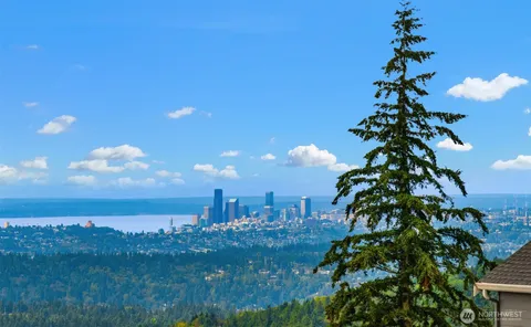 a bathroom with a sink double vanity mirror and a bathtub