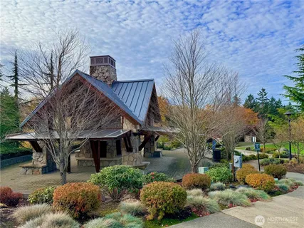 a view of a cars park in front of a building